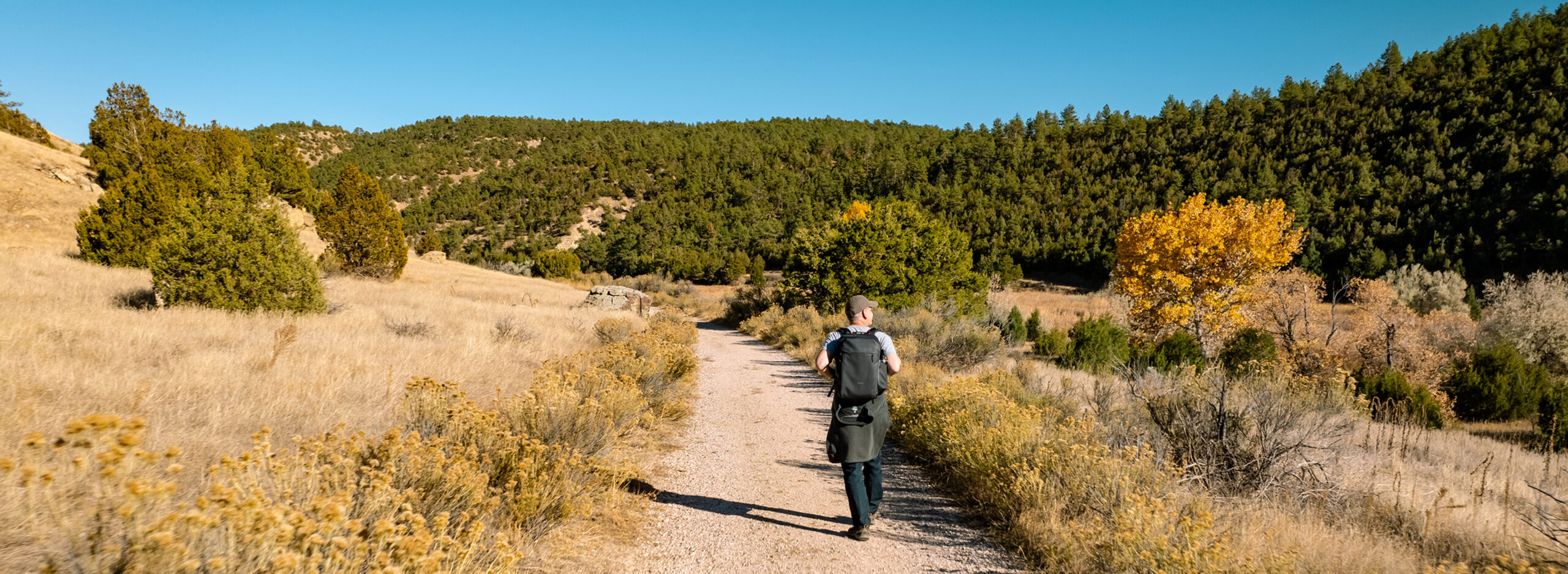 A man hikes along a trail in Glendo, Wyoming.