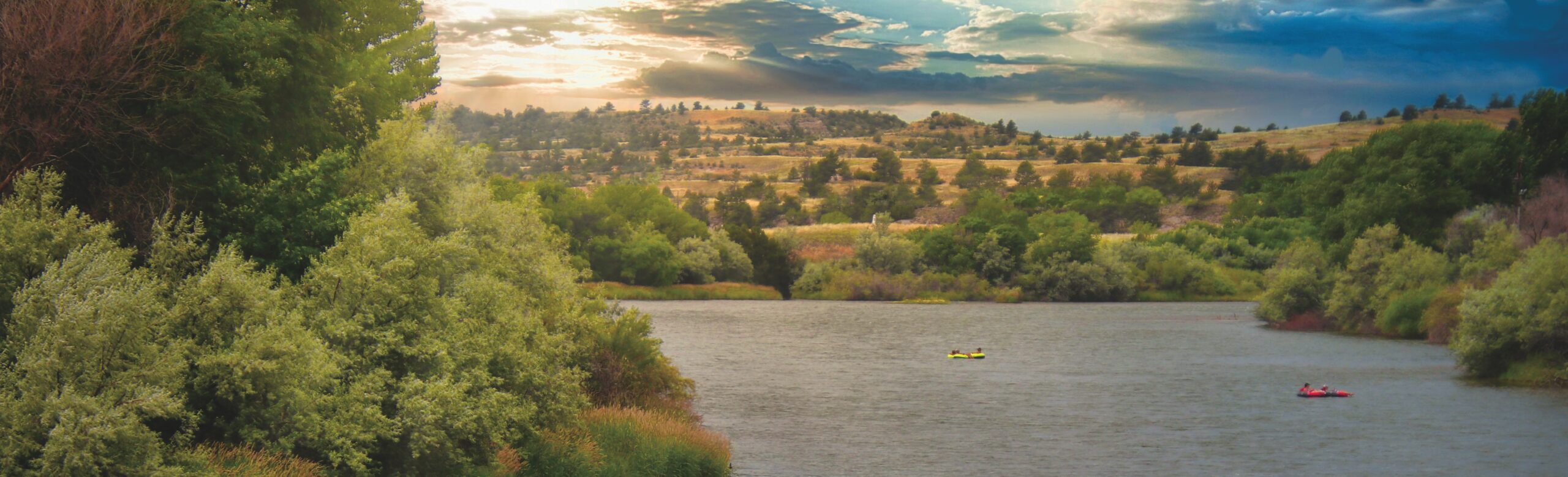 People in kayaks on a river